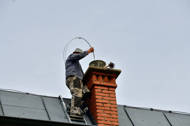 a chimneyer climbs a ladder to the roof to repair a chimney a chimneyer climbs a ladder to the roof to repair a chimney